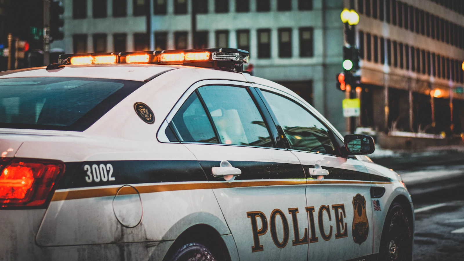 Police car on a city street — Assault with a dangerous weapon in Oklahoma